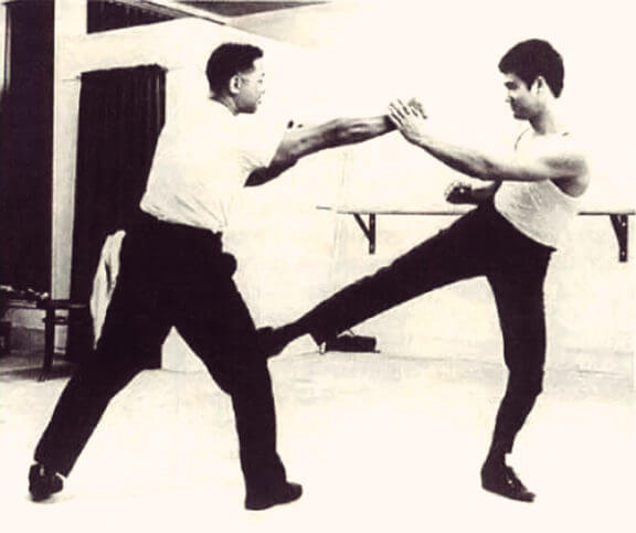Bruce Lee Defending with a Kick